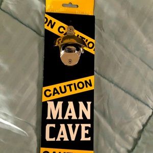 NWT bottle opener, magnetic, says man cave, for hanging on a wall in your bar.